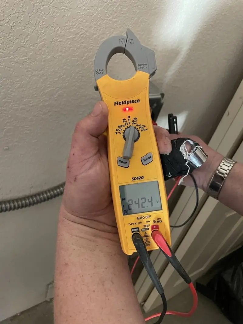 Voltage testing with clamp meter during Electrical Installation Services in Havelock